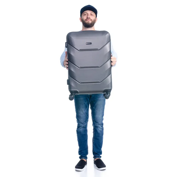 Kot pantolonlu bir adam seyahat çantası tutuyor. — Stok fotoğraf