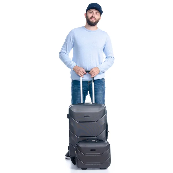 stock image Man in jeans with travel suitcase standing