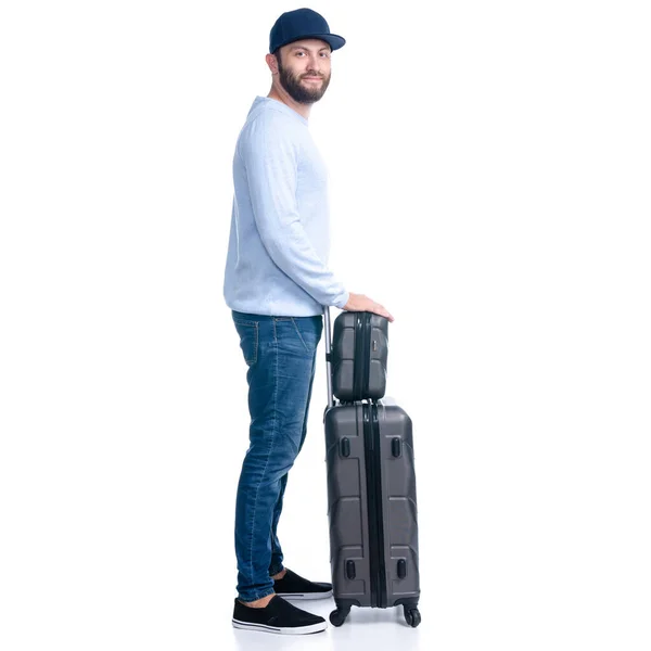 Mann in Jeans mit Reisekoffer steht — Stockfoto