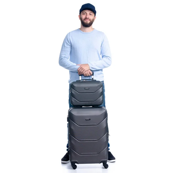 Hombre en jeans con maleta de viaje de pie — Foto de Stock