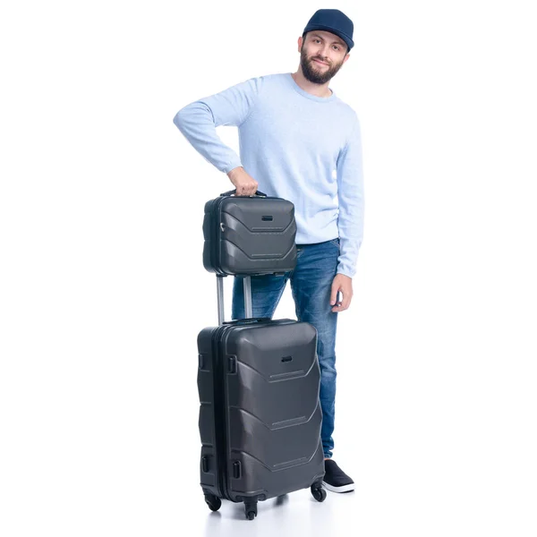 Mann in Jeans mit Reisekoffer steht — Stockfoto