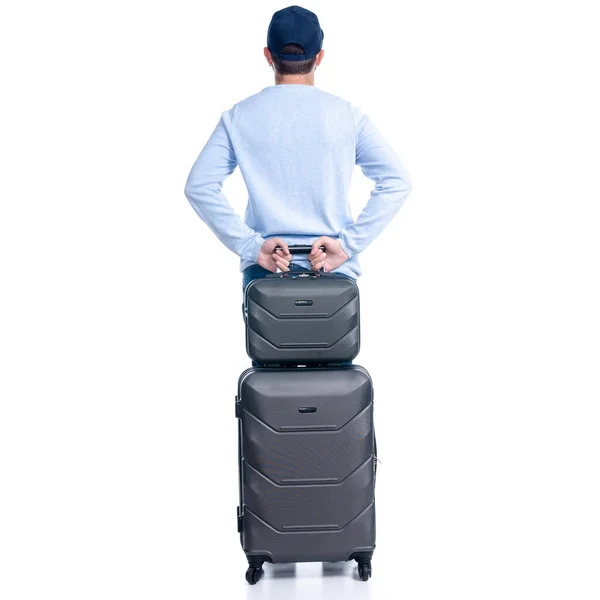 Hombre en jeans con maleta de viaje de pie — Foto de Stock