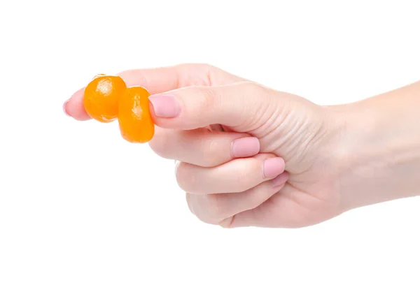 Kumquat essiccato candito in mano — Foto Stock