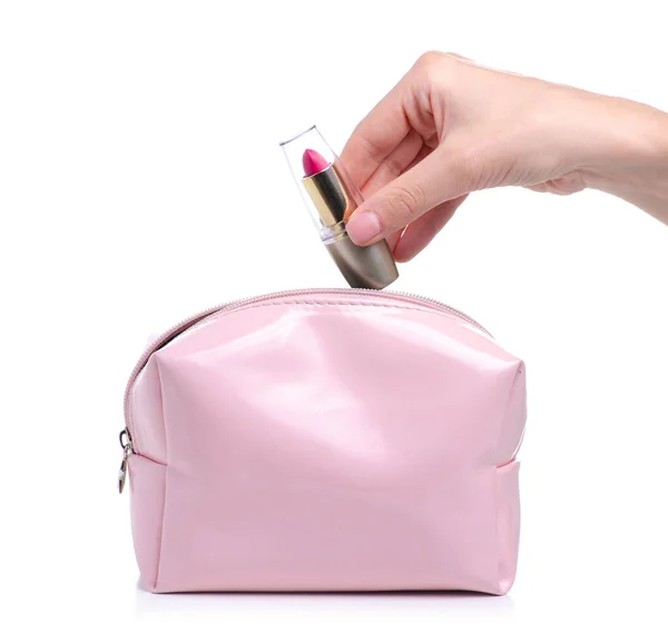 Pinkfarbener Lippenstift in der Hand in Kosmetiktasche — Stockfoto