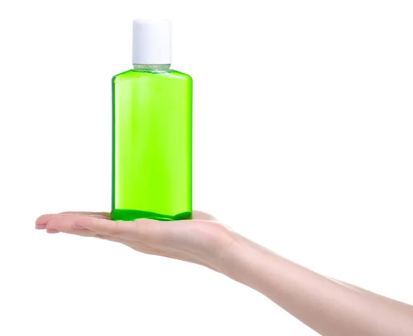 Green mouthwash dental care in hand — Stock Photo, Image