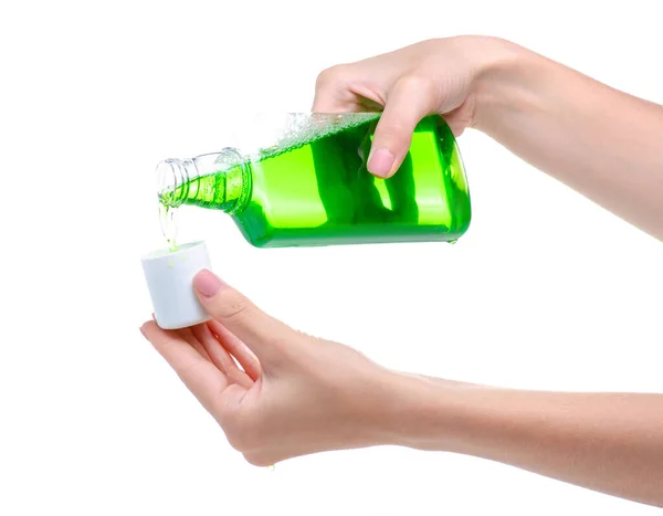 Green mouthwash dental care in hand — Stock Photo, Image