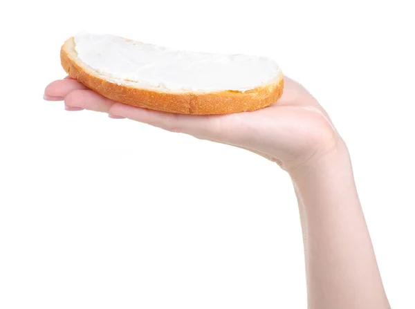 Bread with cream cheese processed in hand — Stock Photo, Image