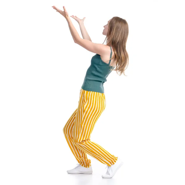 Woman in yellow pants smiling happiness standing looking showing pointing — Stock Photo, Image