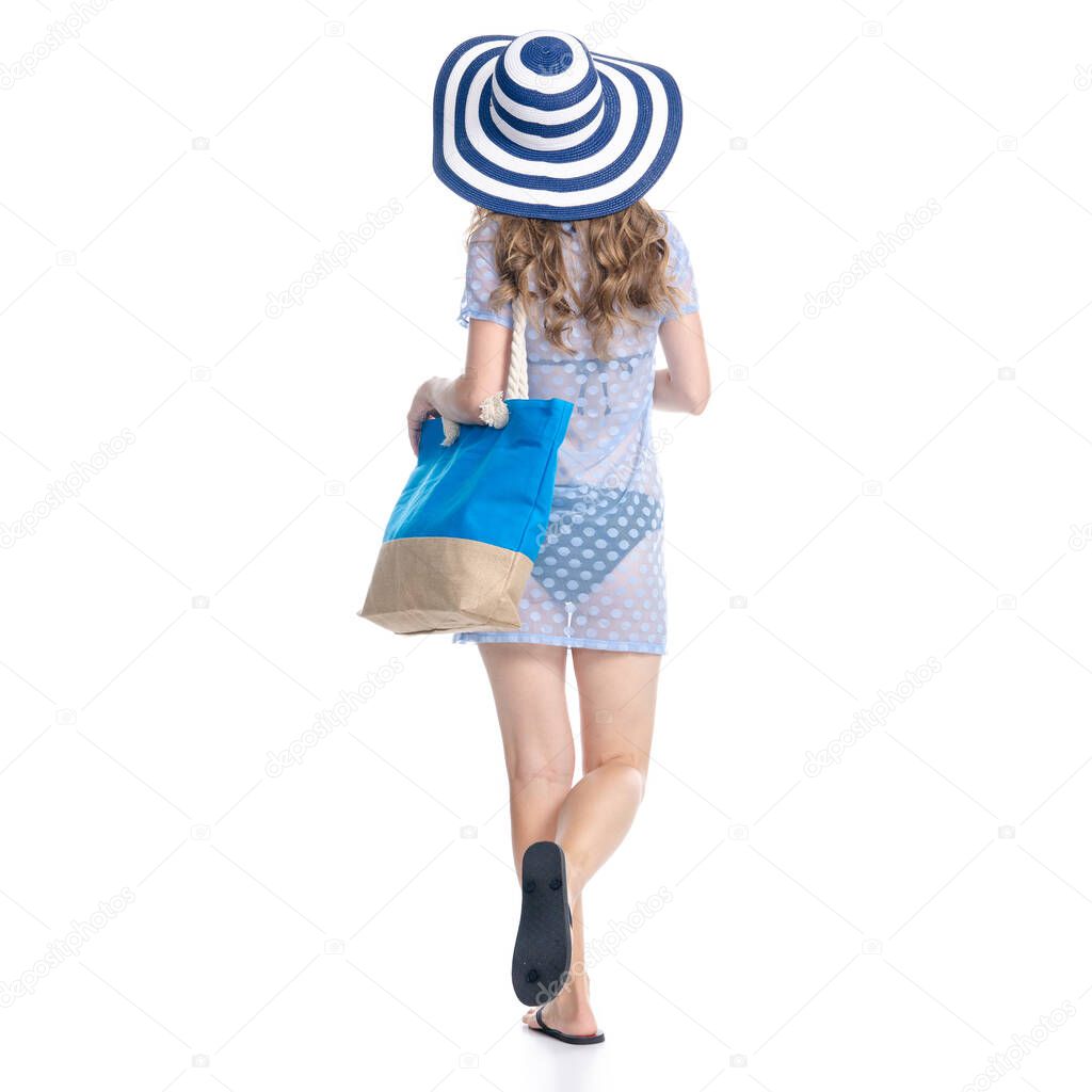 Woman in sun hat, sunglasses and beach bag summer smiling happiness looking walking goes