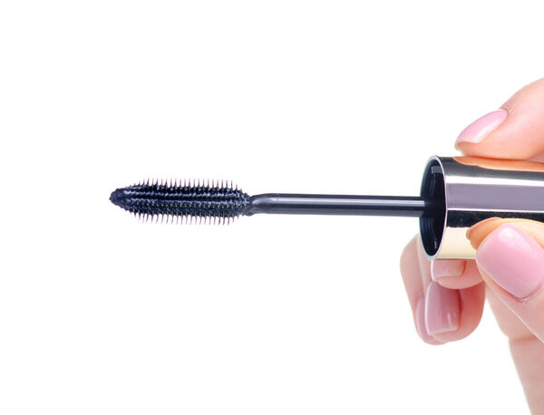 Black mascara brush in hand beauty macro