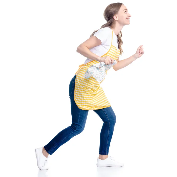 Woman in yellow apron smile holding kithcen towel in hands goes running — Stock Photo, Image