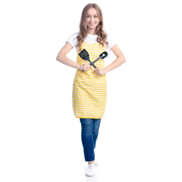 Mujer en delantal amarillo con utensilios de cocina herramientas en la mano —  Fotos de Stock