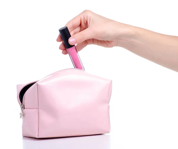 Pink lip gloss dimasukkan ke dalam tas kosmetik Stok Foto