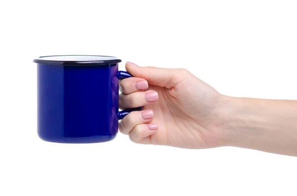 Modrý smaltovaný šálek v ruce — Stock fotografie
