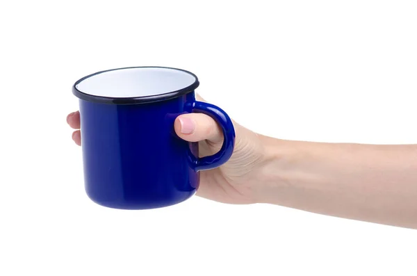 Чашка синей эмали в руке — стоковое фото