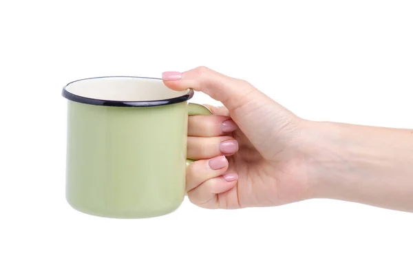 Zöld zománc csésze a kézben — Stock Fotó