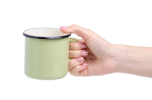 Tazza di smalto verde in mano — Foto Stock