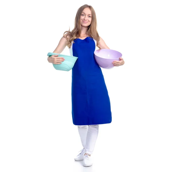 Nő kék kötényben, konyhai tálkával a kezében — Stock Fotó