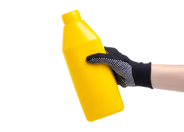 Botella amarilla imprimación industrial en mano —  Fotos de Stock