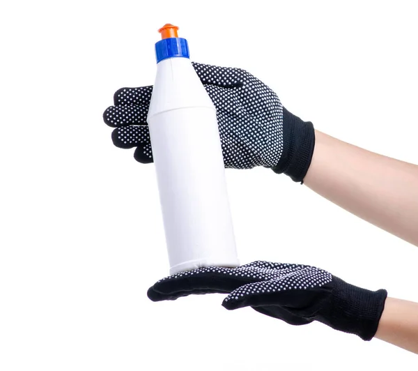 Руки в рабочих перчатках с бутылкой клея — стоковое фото