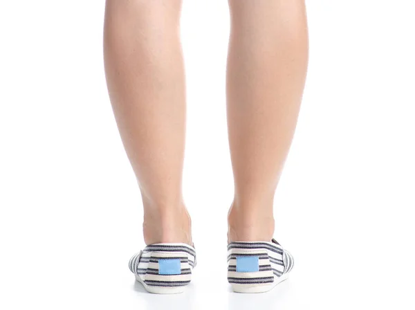 Vrouwelijke benen in espadrilles — Stockfoto