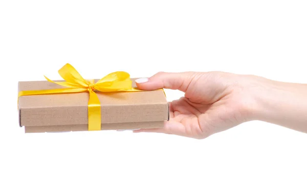 Box mit gelber Schleife Geschenk in der Hand — Stockfoto