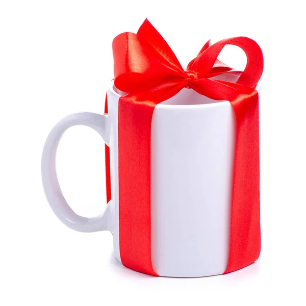 Tasse blanche tasse avec ruban rouge cadeau arc Images De Stock Libres De Droits