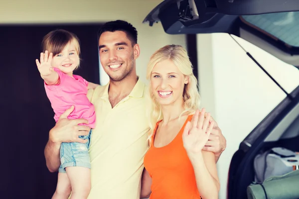Happy family with hatchback car at home parking — Stock Photo, Image
