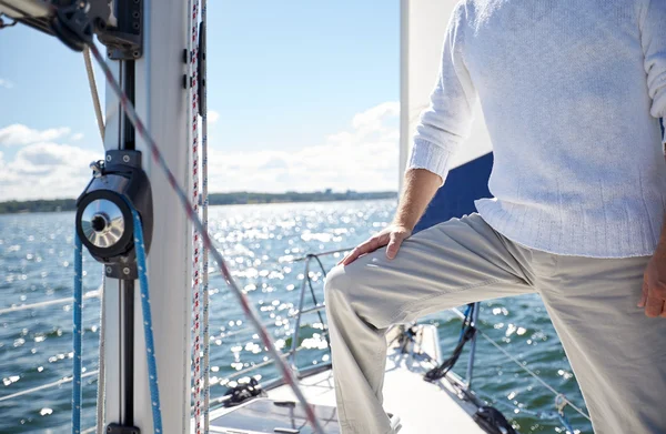 Close up of senior man on yacht sailing in sea — Stock Photo, Image