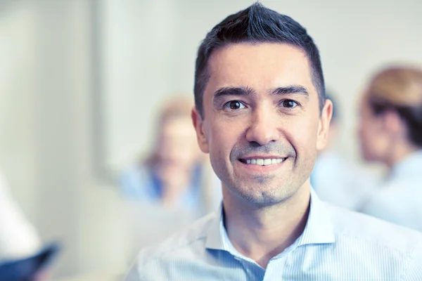 Smiling businessman face in office — Stock Photo, Image