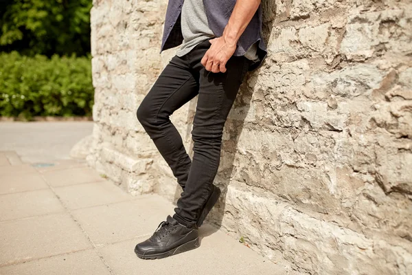 Close up of man standing at street wall — Stock Photo, Image