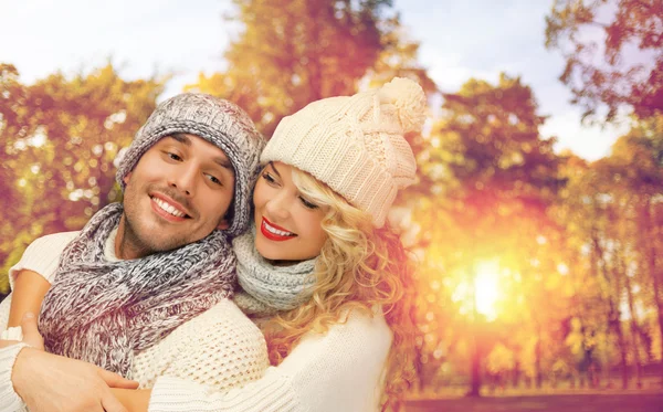 Happy couple in warm clothes over autumn — Stock Photo, Image