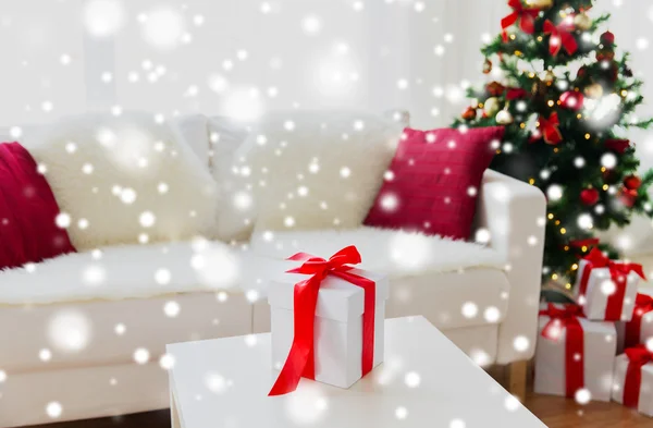 Close up of christmas gift box on table at home — Stock Photo, Image