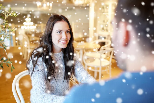 Happy couple talking at cafe or restaurant — Stock Photo, Image