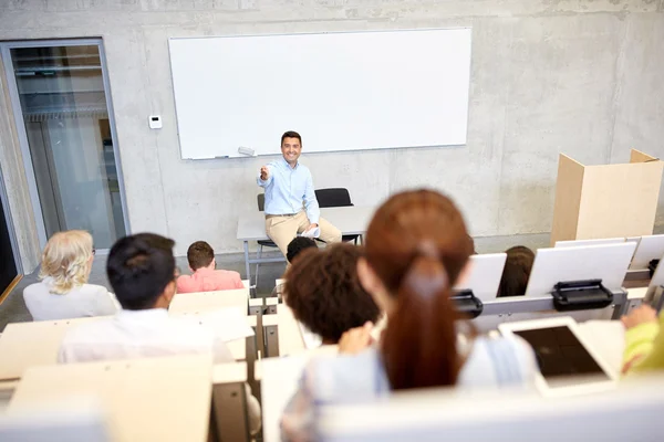 Group of students and teacher at lecture — Stock Photo, Image