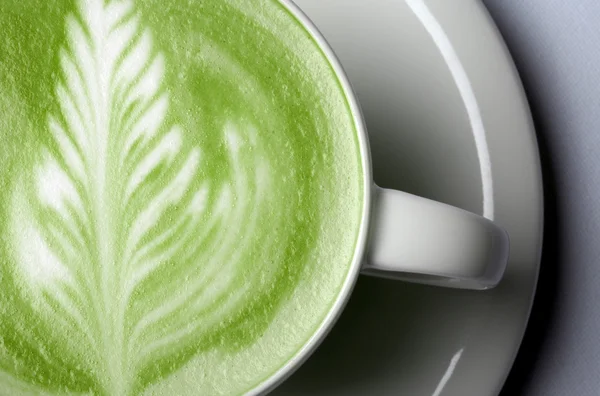Close up of matcha green tea latte in cup — Stock Photo, Image