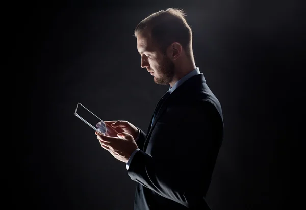 Close up of businessman with transparent tablet pc — Stock Photo, Image