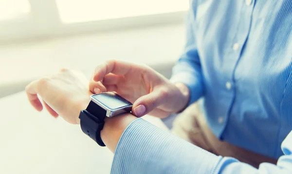 Close up of hands setting smart watch — Stock Photo, Image