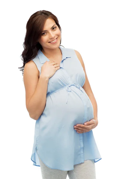 Feliz embarazada tocando su gran vientre —  Fotos de Stock