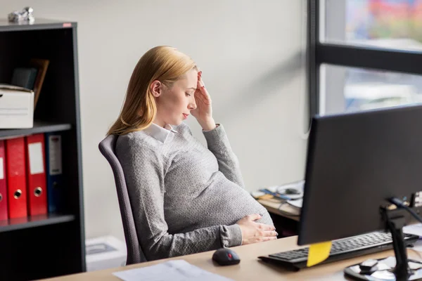 Pregnant businesswoman feeling sick at office work — Stock Photo, Image