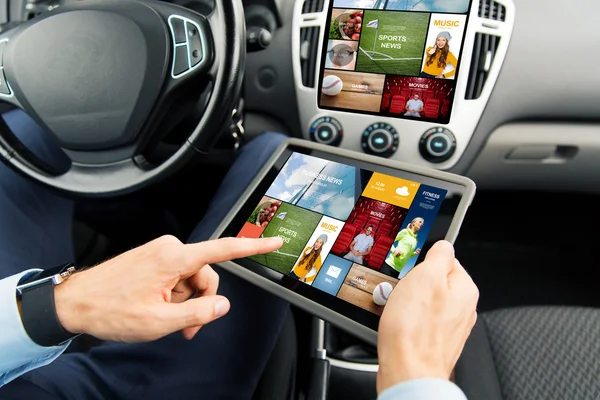 Close up of man with tablet pc in car — Stock Photo, Image