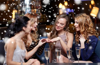 woman showing engagement ring to her friends clipart