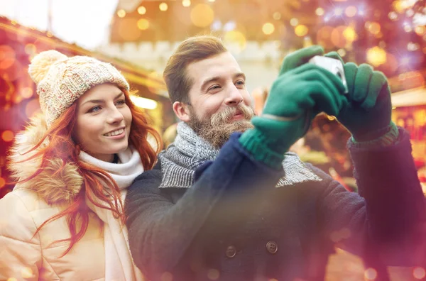 Couple taking selfie with smartphone in old town — Stock Photo, Image