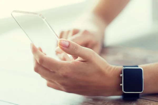 Close up of hands with smart phone and watch — Stock Photo, Image