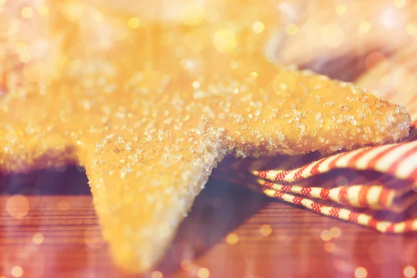 Close up of star gingerbread cookie and towel — Stock Photo, Image