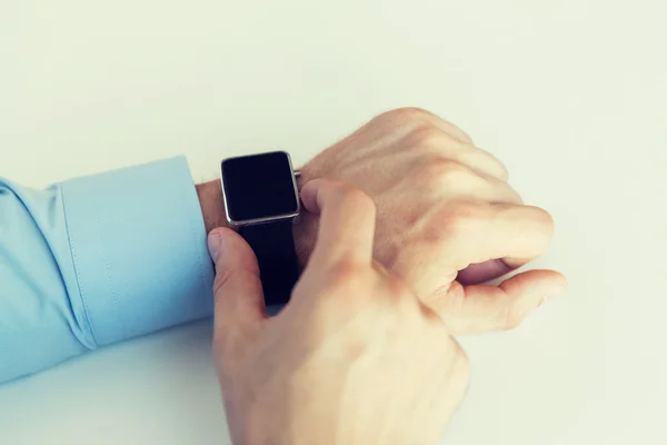 Close up of male hands setting smart watch — Stock Photo, Image