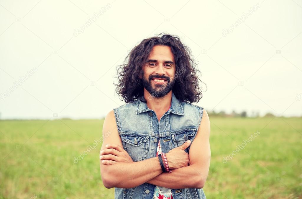 Smiling Young Hippie Man On Green Field Stock Photo By