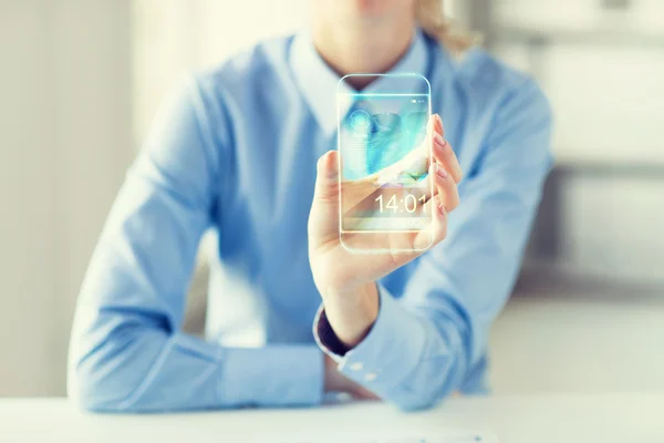 Primer plano de la mujer con teléfono inteligente transparente — Foto de Stock