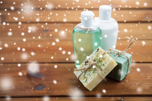 handmade soap bars and lotions on wood