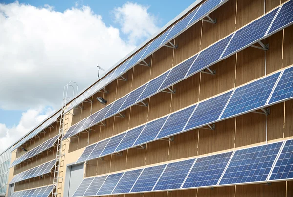 Solar battery panels on building facade — Stock Photo, Image
